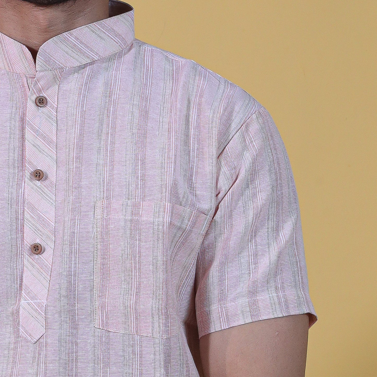 Close-up of light pink striped kurta collar and pocket detail