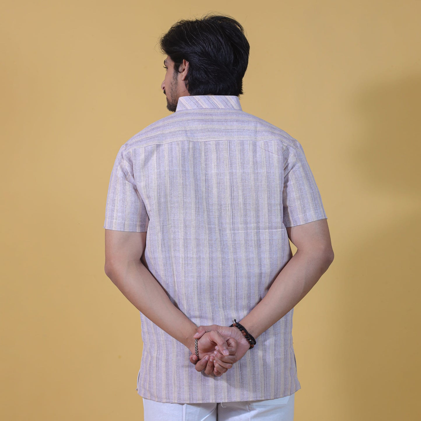 Back view of beige wide striped kurta for men