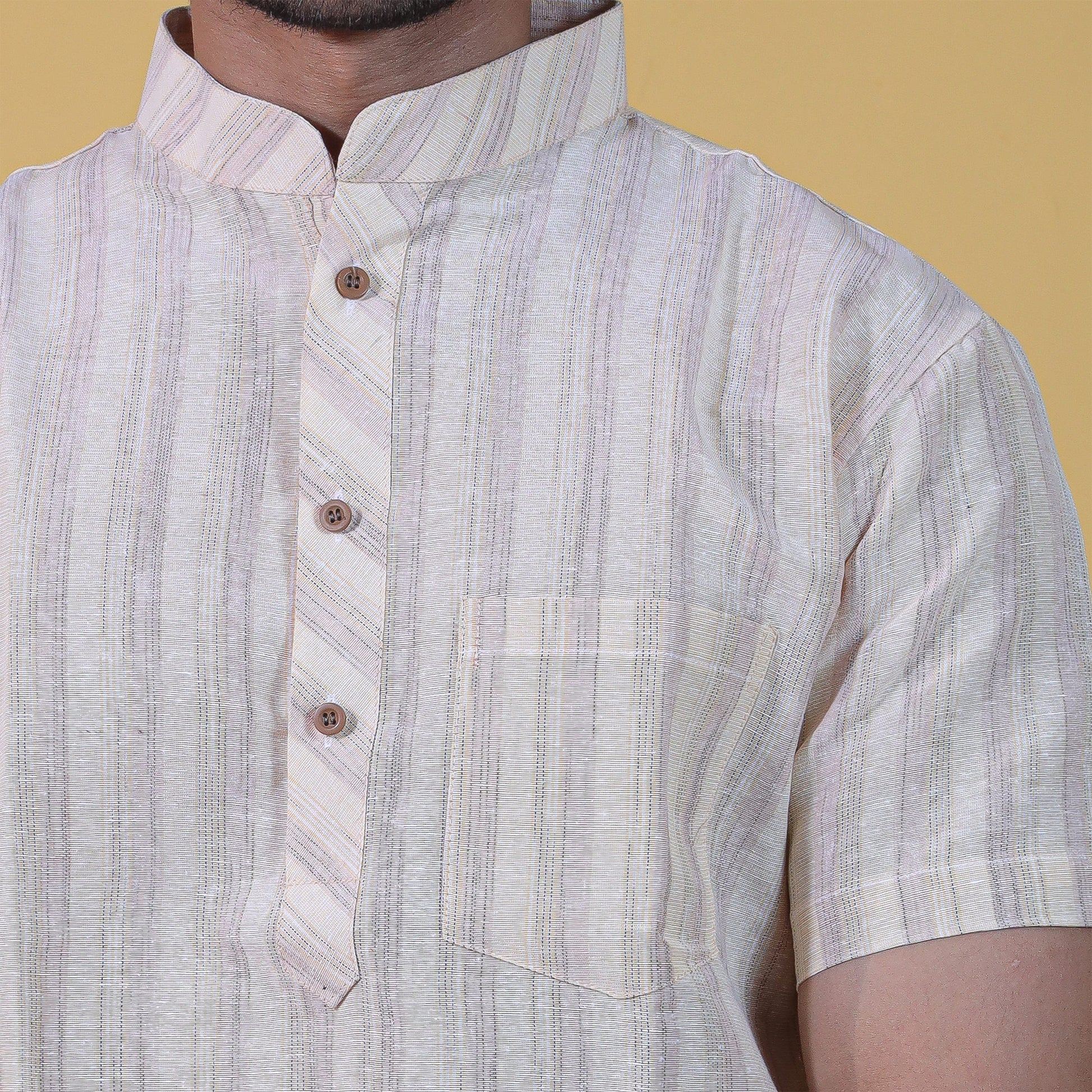 Close-up of yellow wide striped kurta collar and pattern