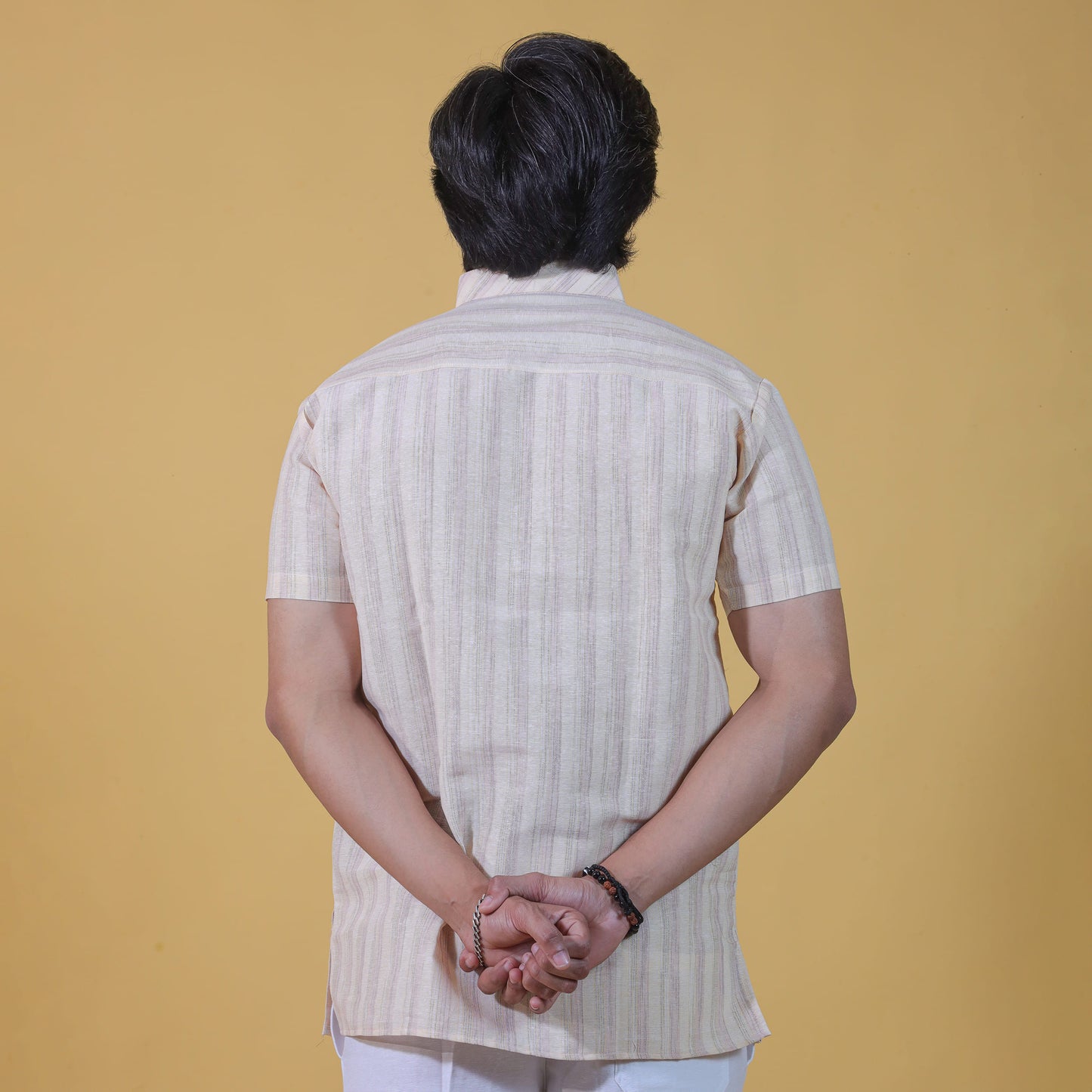 Back view of yellow wide striped kurta for men