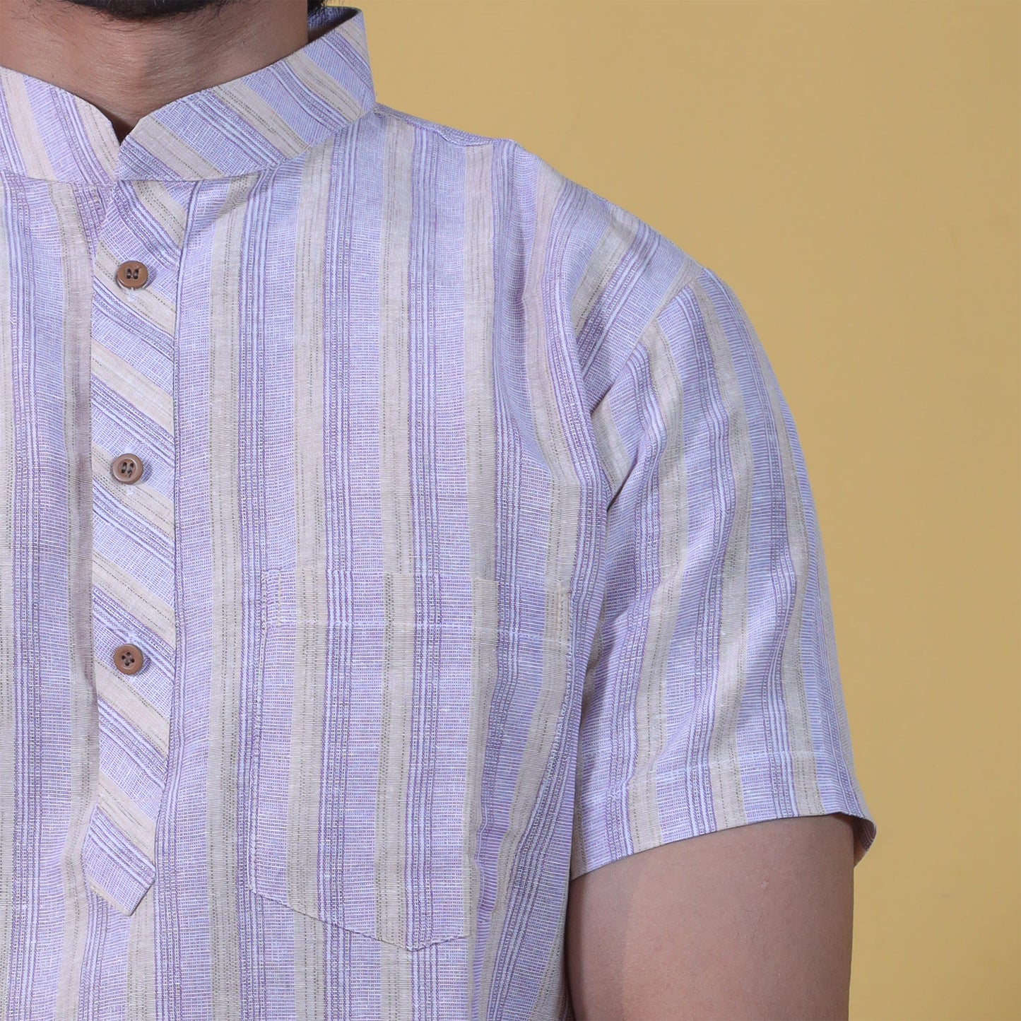 Close-up of purple striped kurta fabric and button placket detail