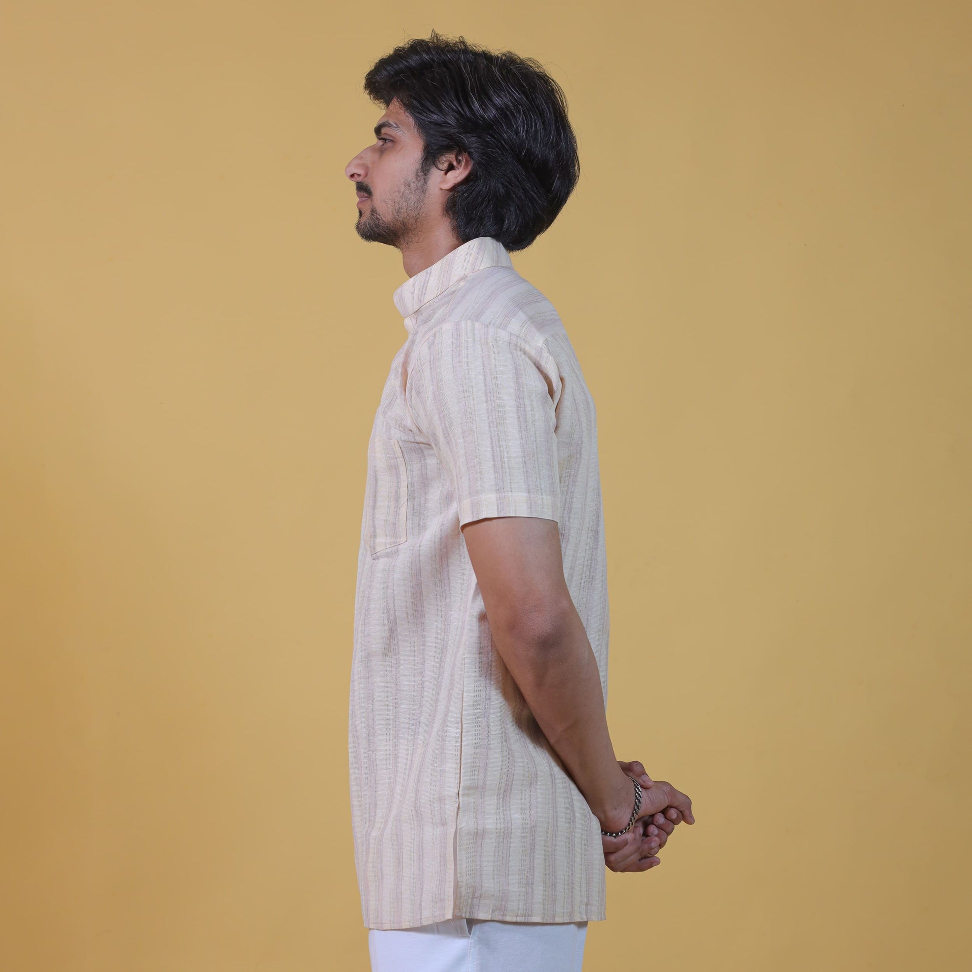 Side profile yellow wide stripe short kurta for men